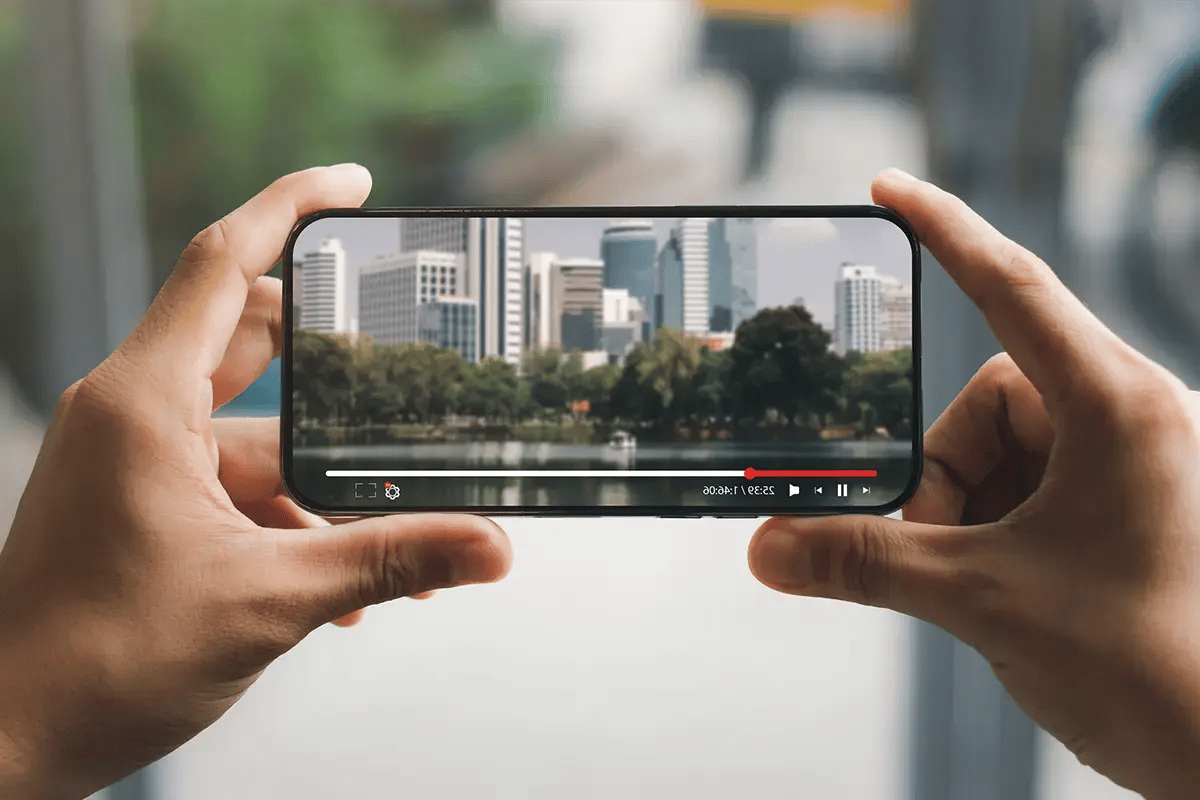A man watching av video on his mobile phone