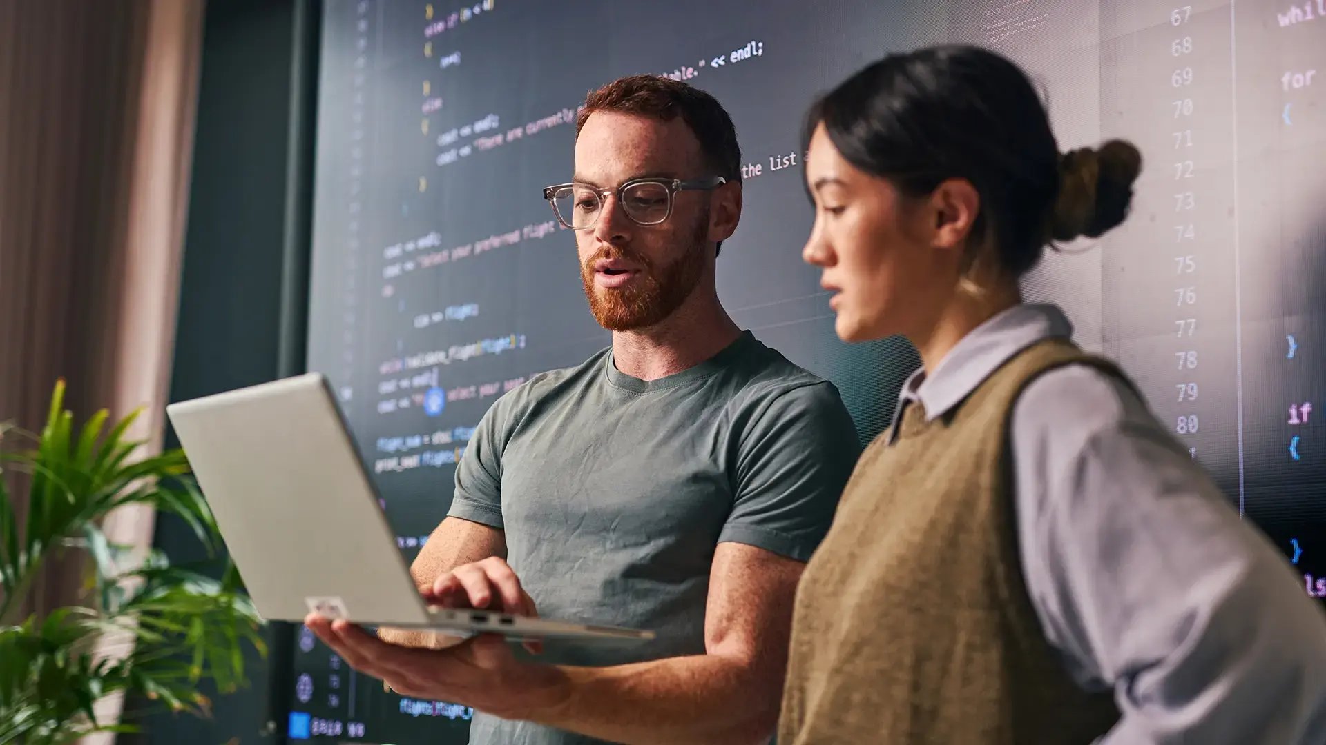 Two software engineers working with AI-Enabled Anomaly Detection