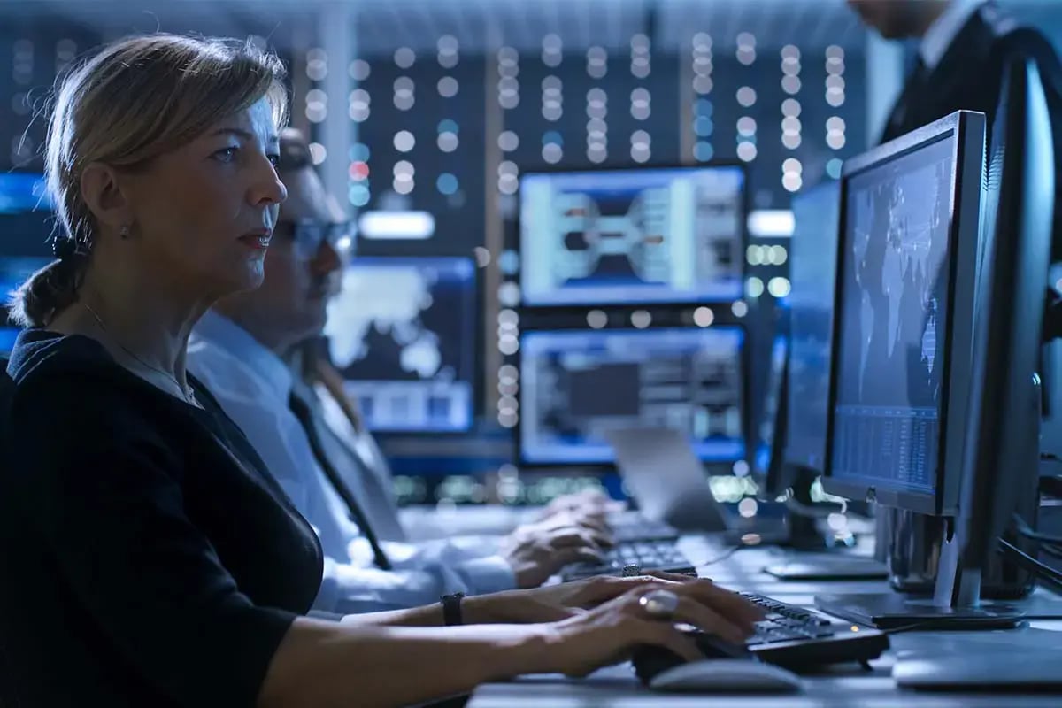 Woman Telecom Engineer working with Performance Management Data