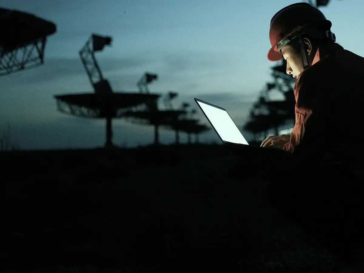 Service Operations in Telecom near a Base Station, Man in helmet