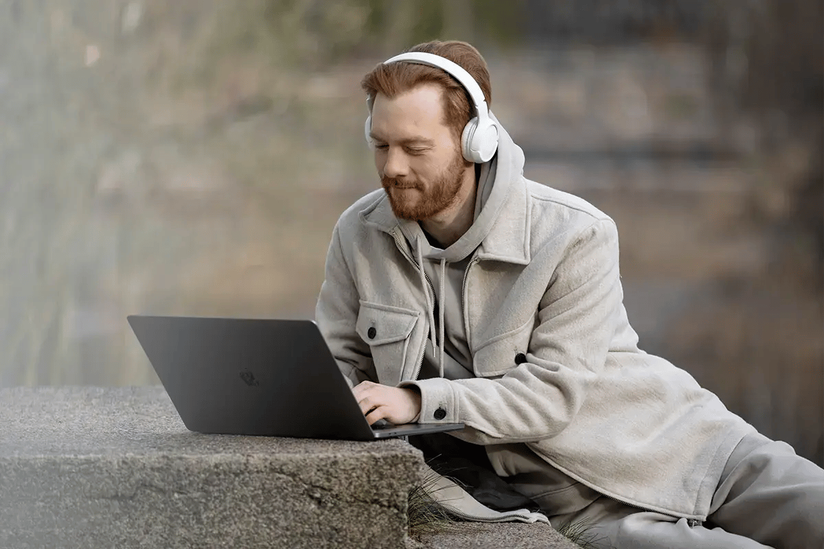A telecom engineer watching an on-demand webinar from Polystar