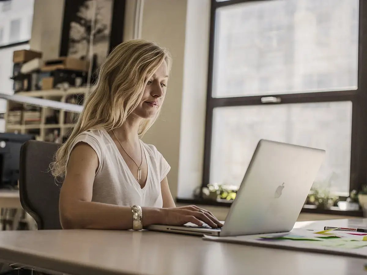 Woman working form home thanks to 5G Fixed Wireless Access