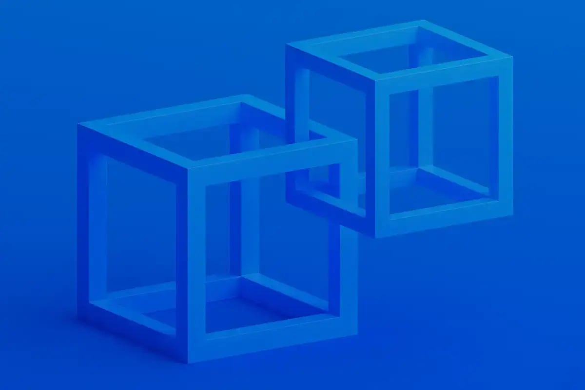 Blue image with two three dimensional squares symbolizing digital twins