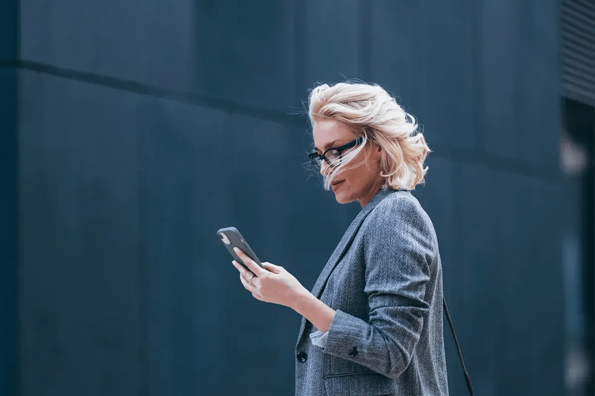 Career woman using her mobile phone for work