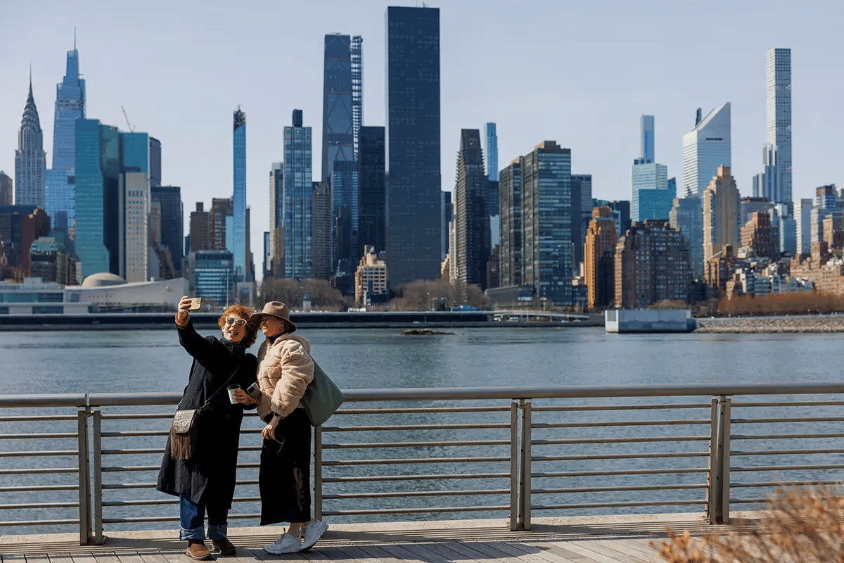 Two women using roaming services while they visit New York