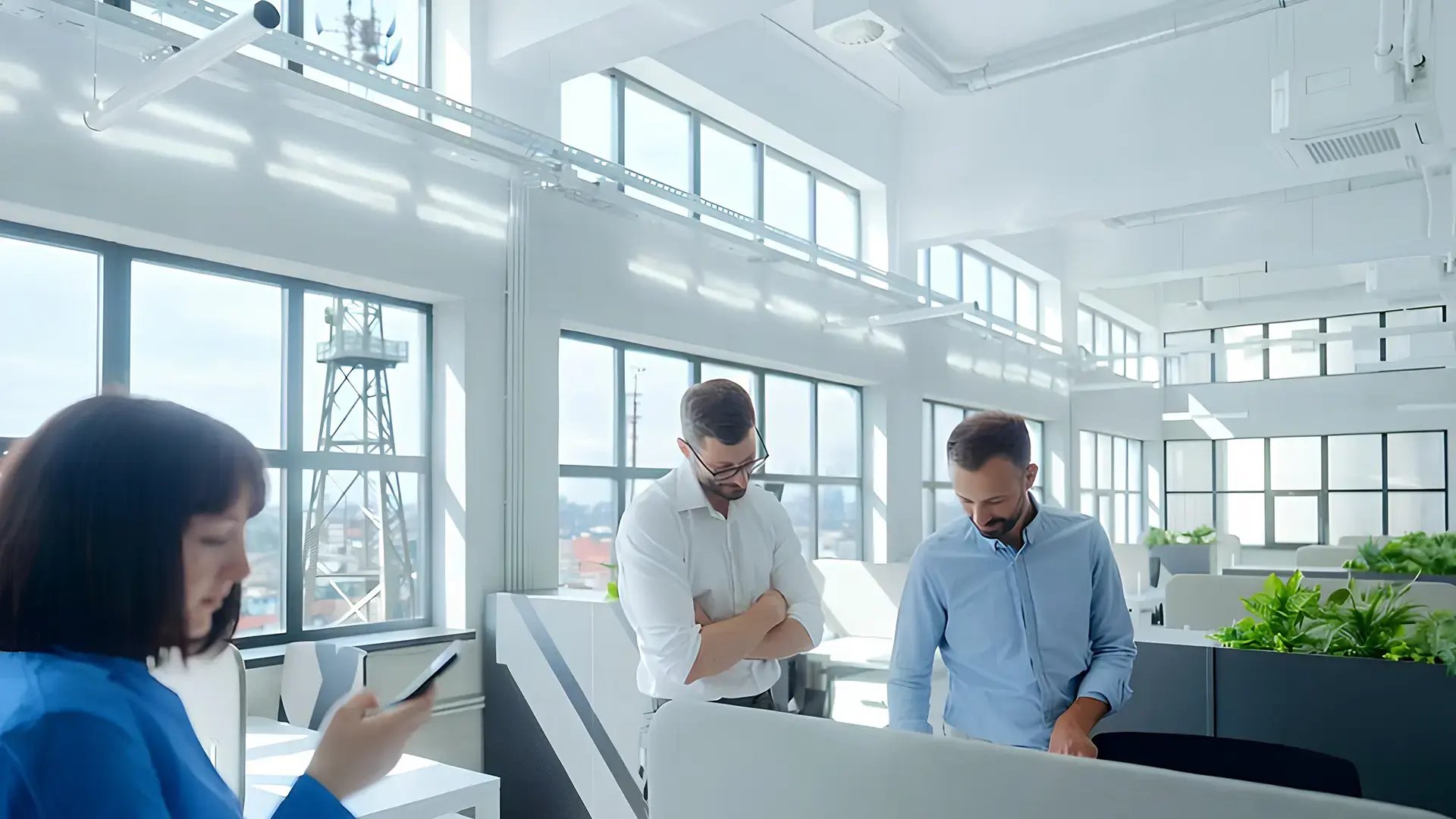Telecom engineers in an informal meeting at the office discussing network KPI forecasting