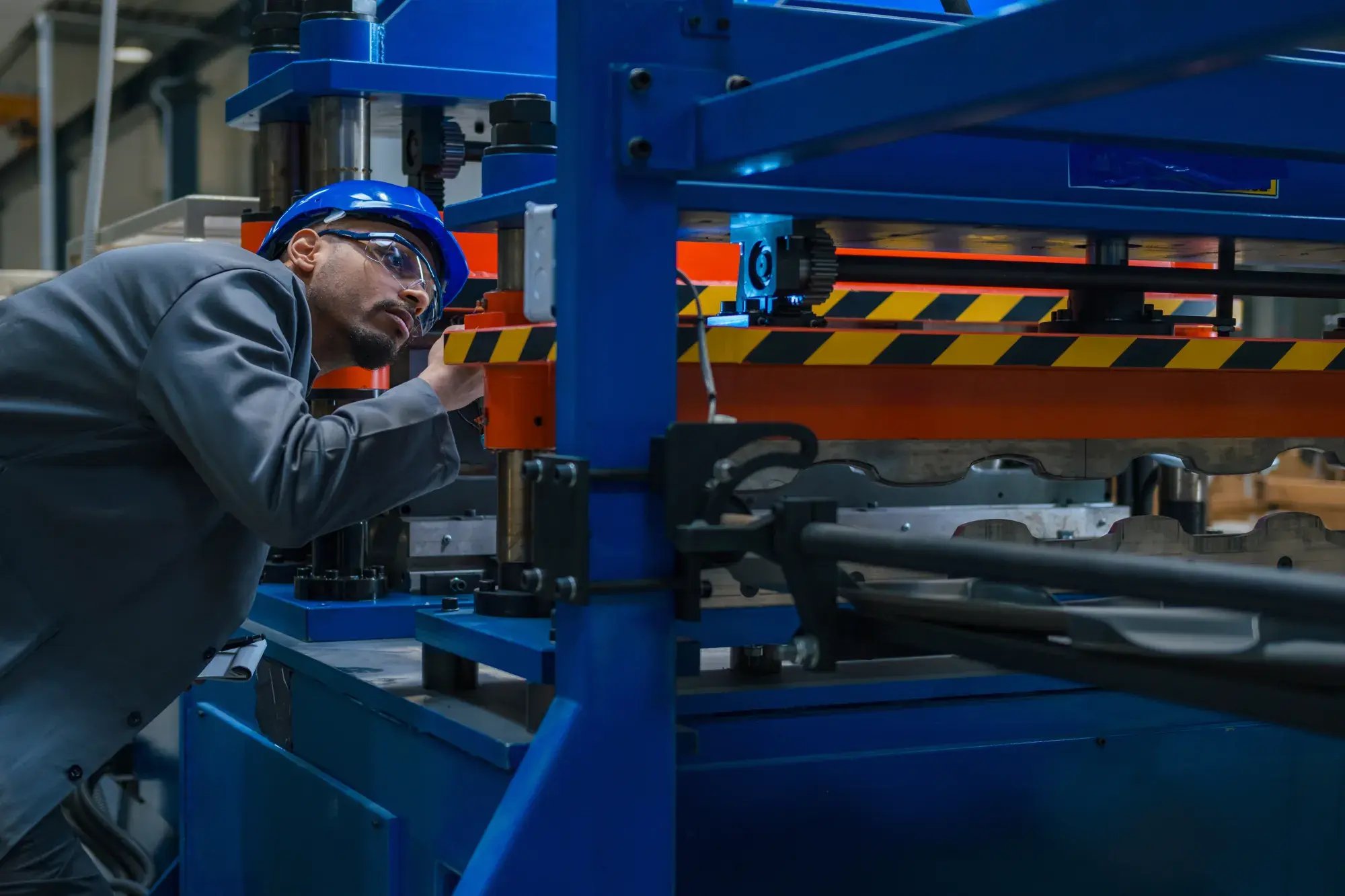 african-american-engineering-technology-professional-holding-flashlight-checking-industrial