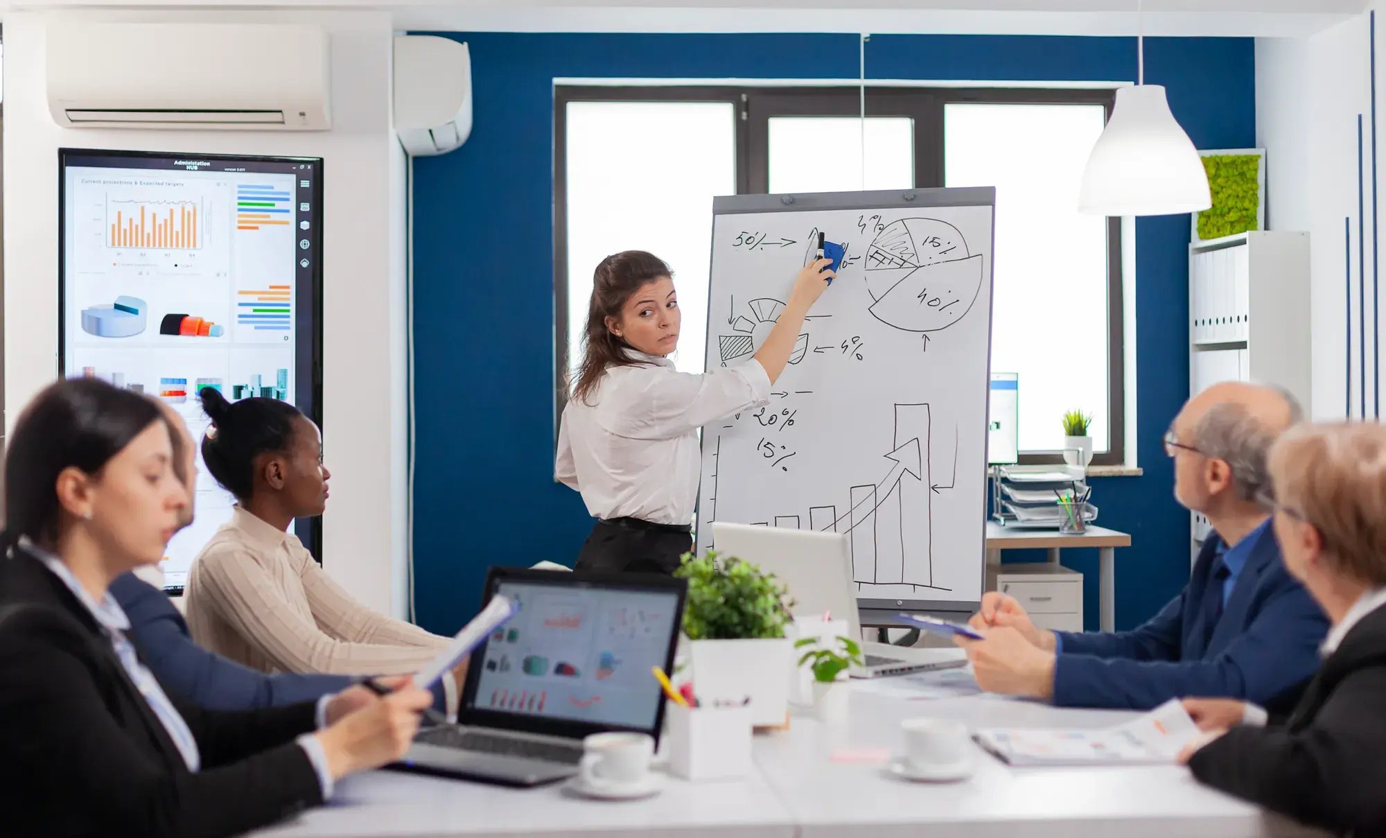 company-head-standing-front-audience-diverse-staff-members-making-presentation
