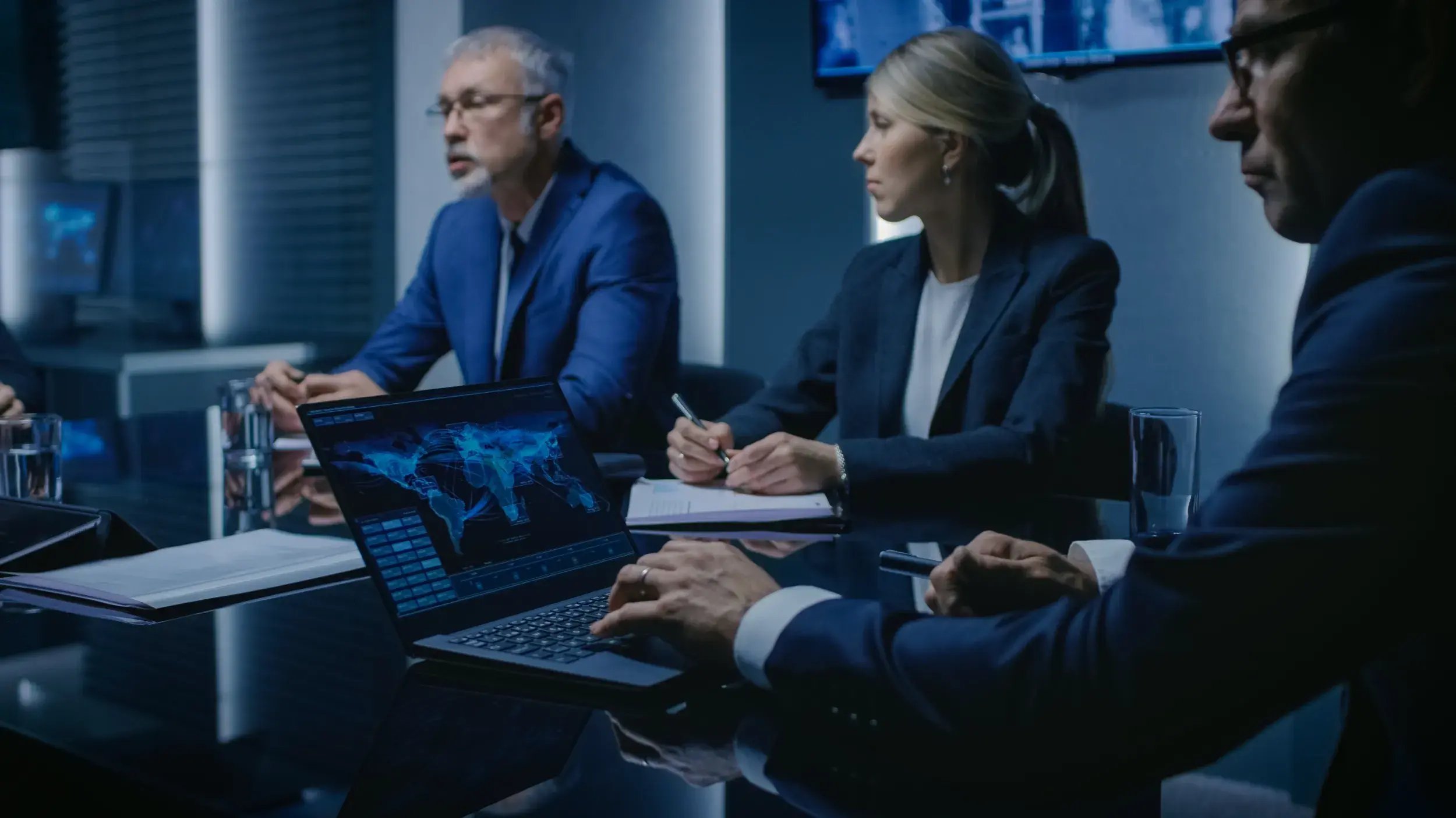 government-agency-officials-having-discussion-emergency-meeting-serious-people-negotiating-conference-room-background-screens-showing-maps-data-flow