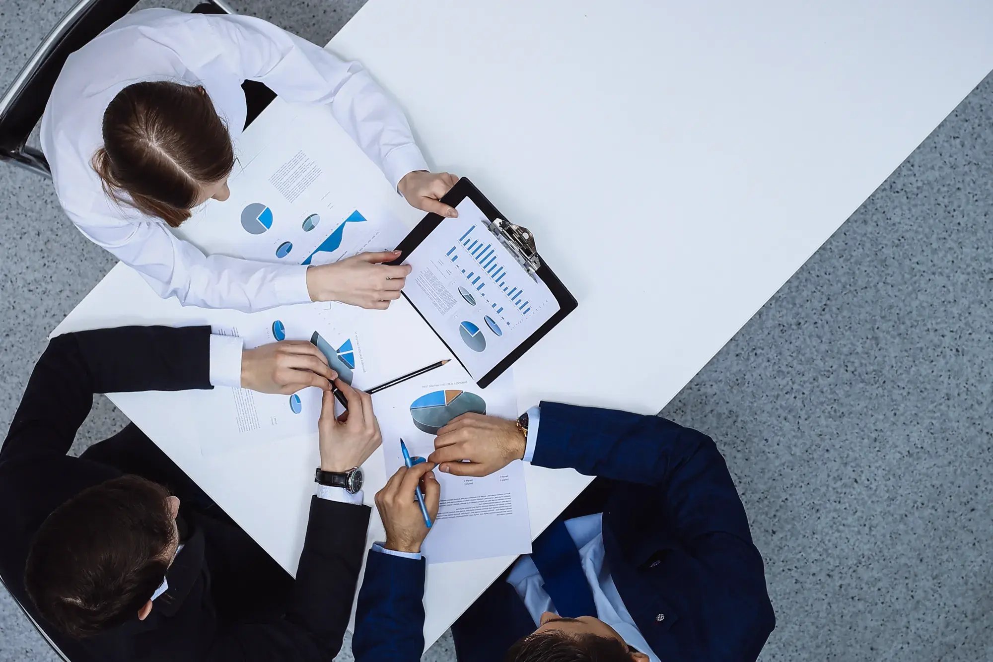group-business-people-analyzing-financial-documents-view-from-business-team-meeting
