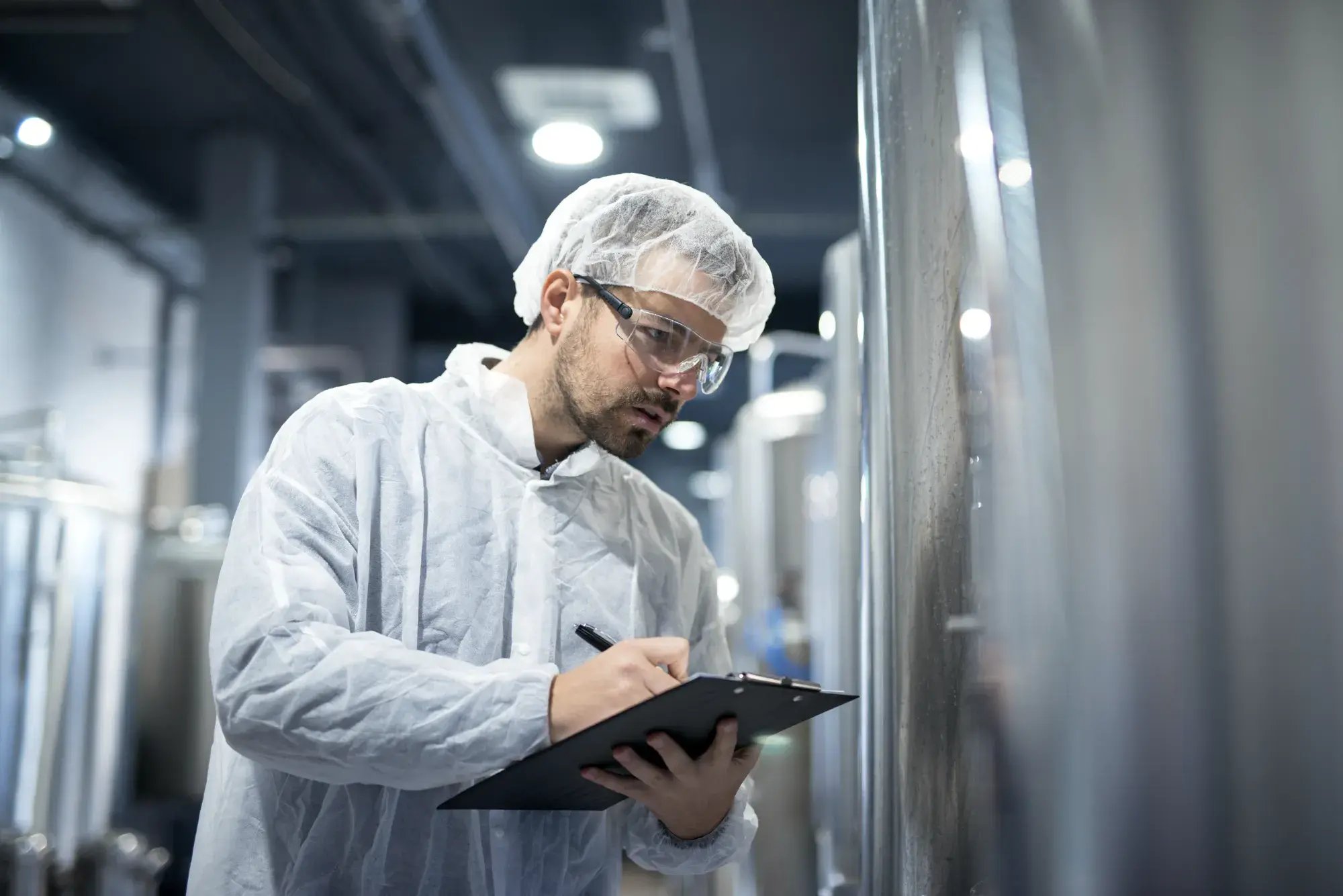 professional-technologist-white-protective-uniform-controlling-industrial-process-production-plant
