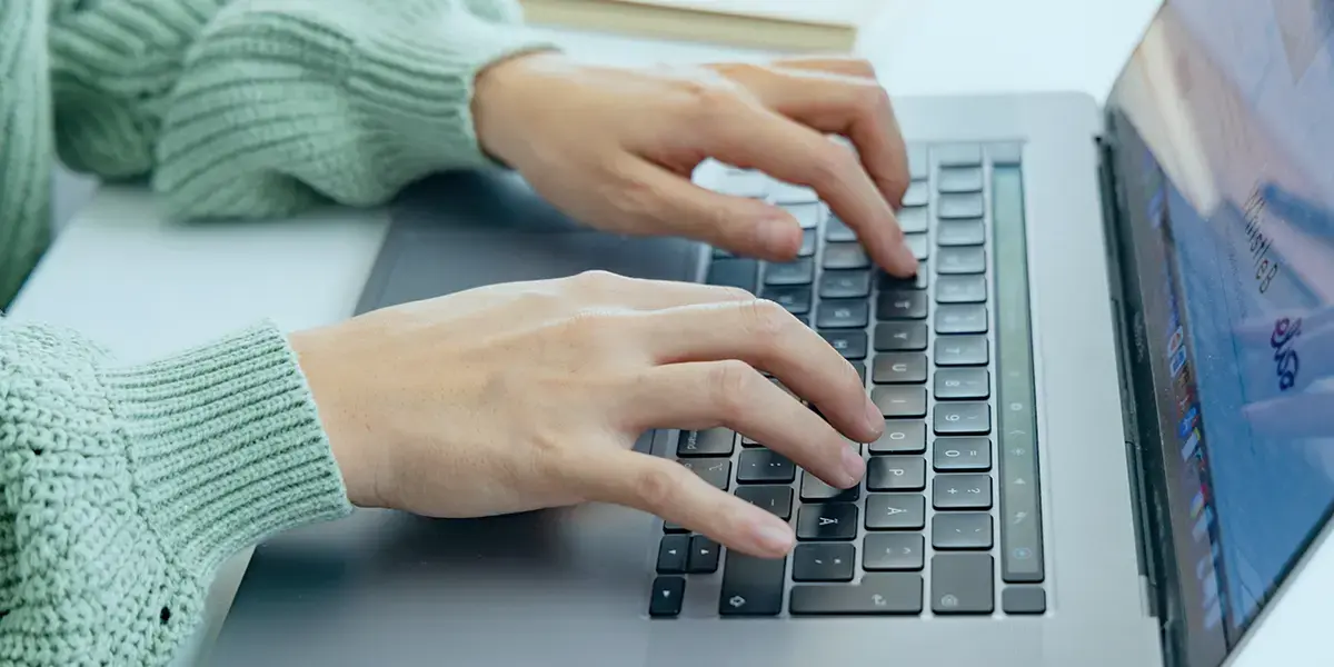 Working with Performance Management KPIs on a laptop