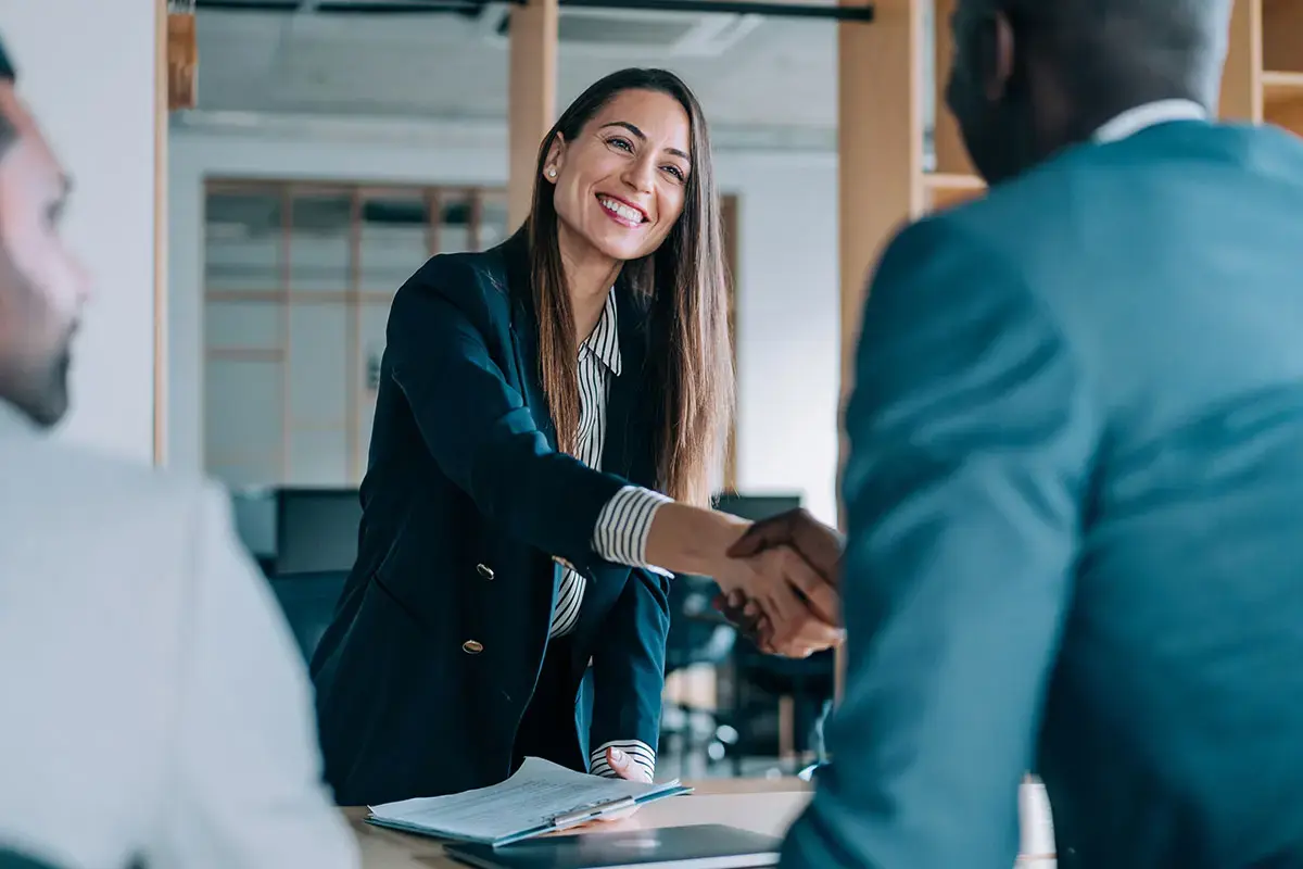 Woman Account Manager at a customer meeting