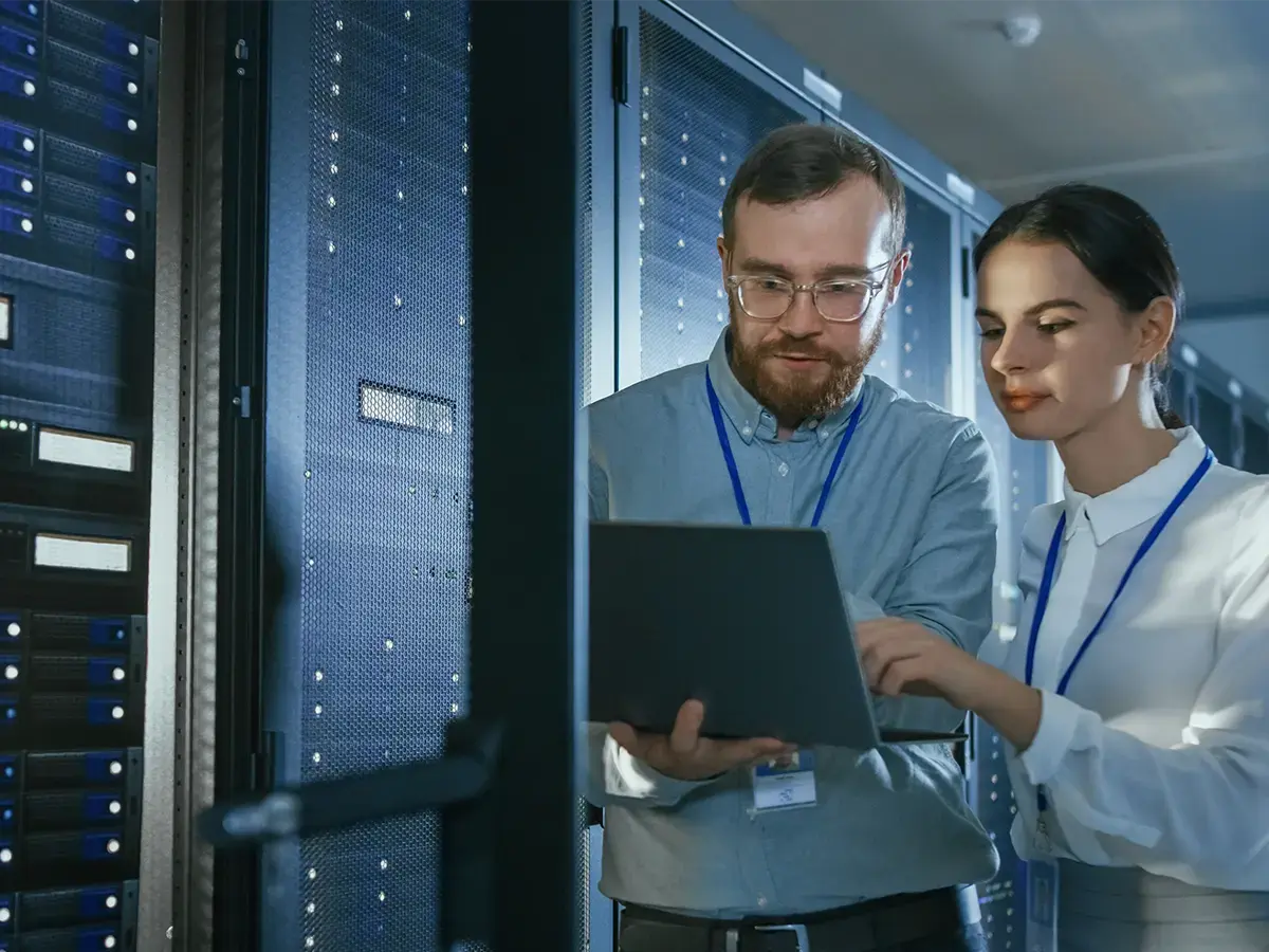 Two telecom engineers working with operational efficiency