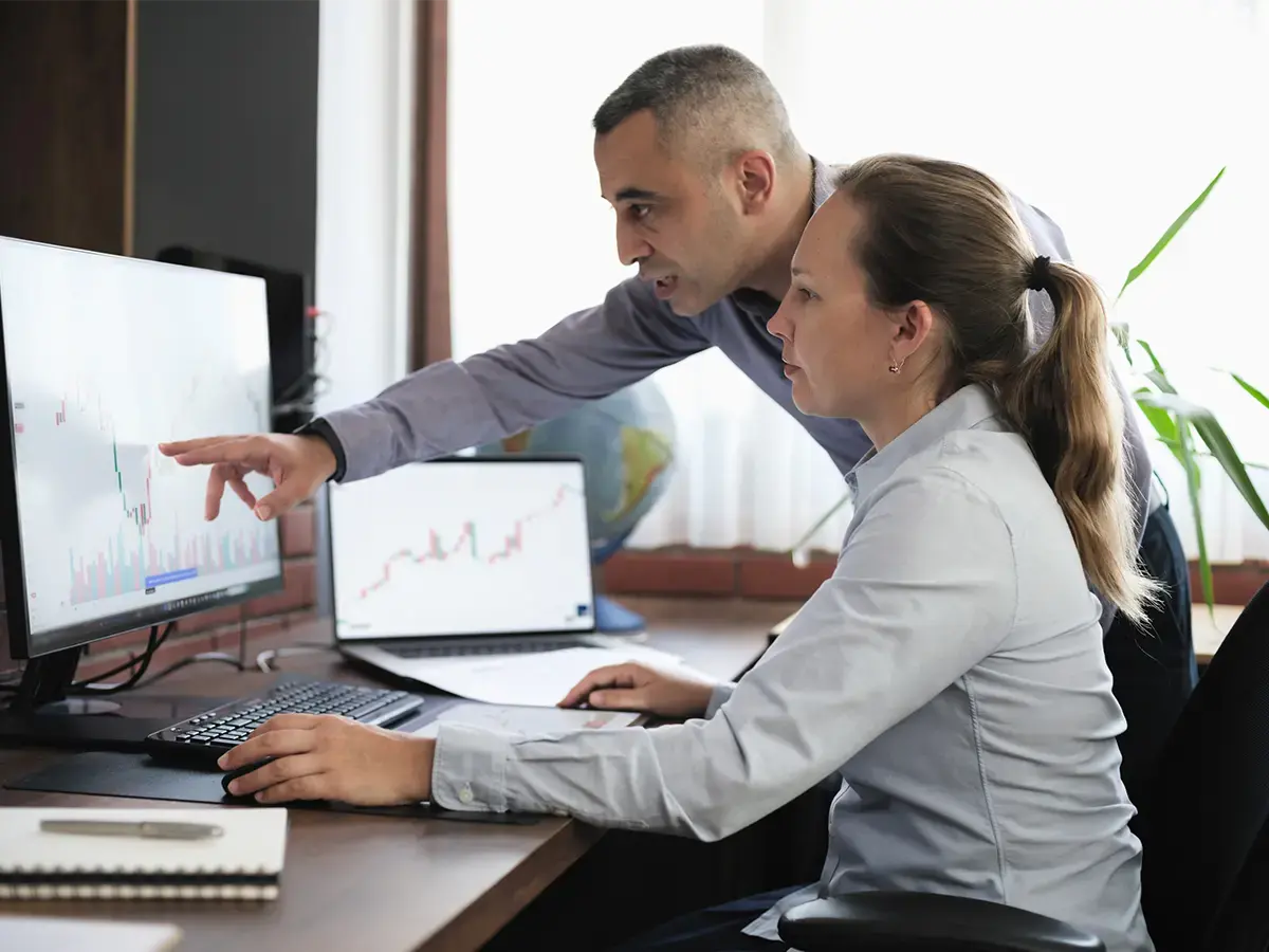 Two telecom engineers working to combine PM and Probe data for future automation